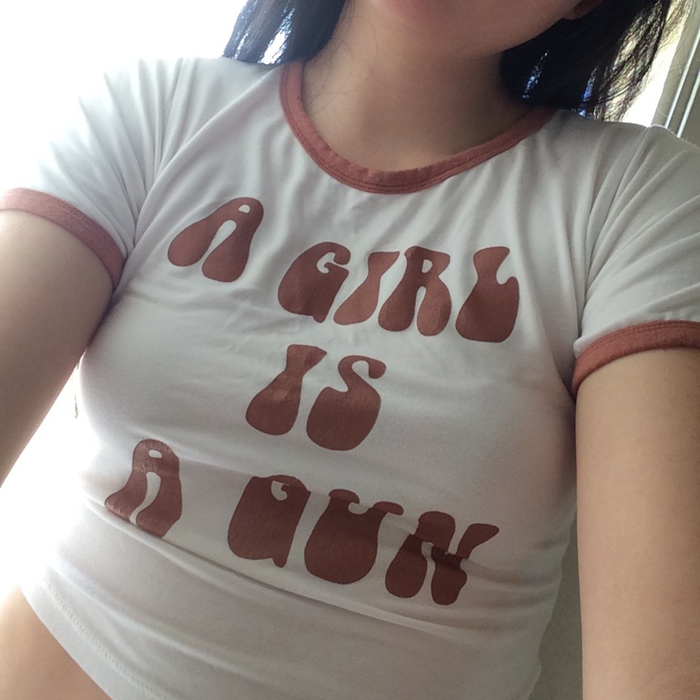 A girl is a gun tee. Not UO From O'mighty.