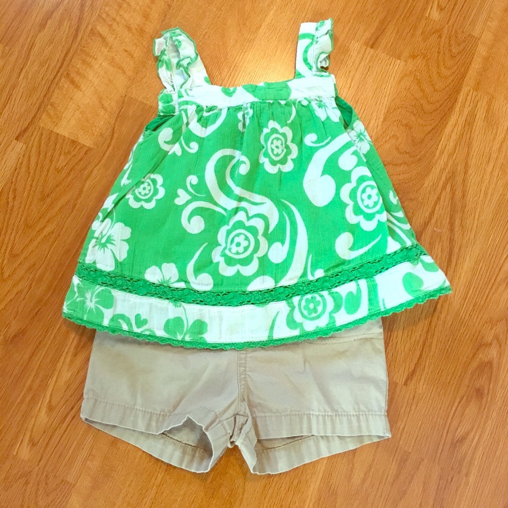 Green and white floral top with khaki shorts
