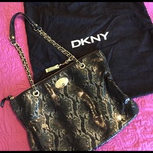 DKNY snakeskin bag with gold details.