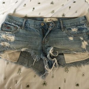 Distressed light denim shorts
