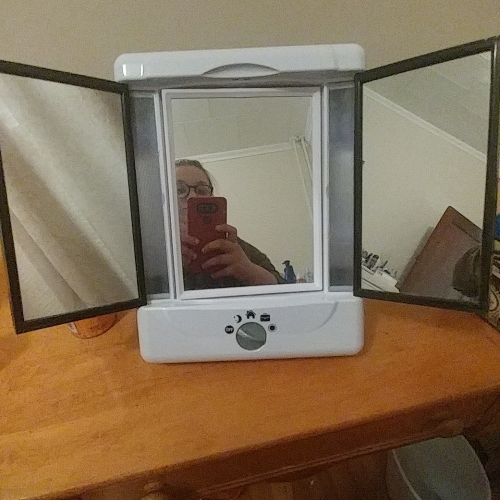 Double sided, 4 way light setting vanity mirror