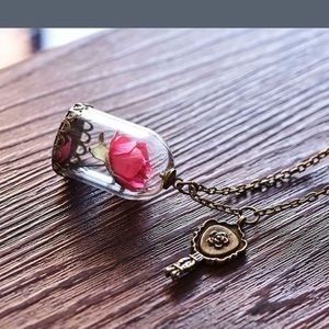 Beauty and beast inspired rose in glass necklace