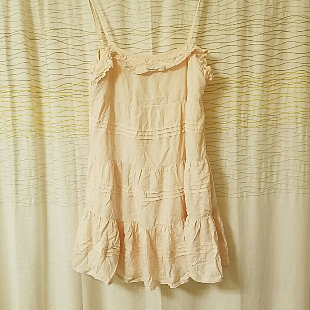 S peach colored slip / sum dress with ruffles.