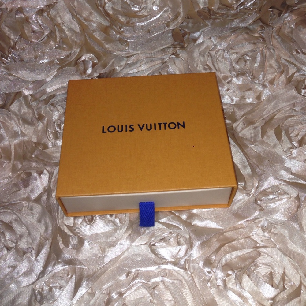 Small Louis Vuitton box with dust bag.