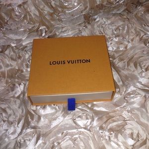 Small Louis Vuitton box with dust bag.