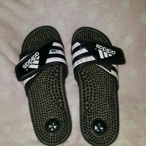 Old worn Adidas slides