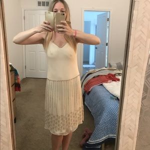 Beige cocktail dress with silver beading.