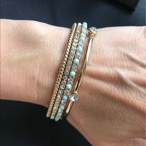 Set of 4 gold tone bangles