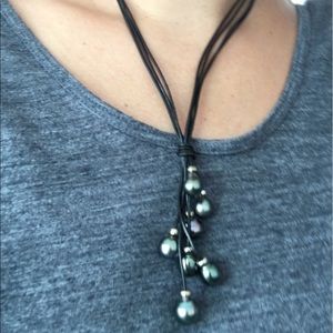 Black Tahitian pearls on black leather cord.