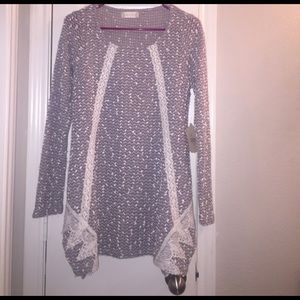 Gray and white knit sweater.