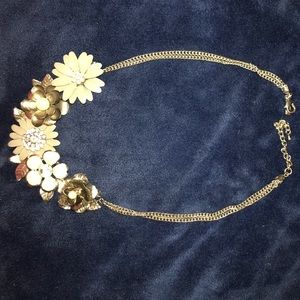 A grey flower necklace