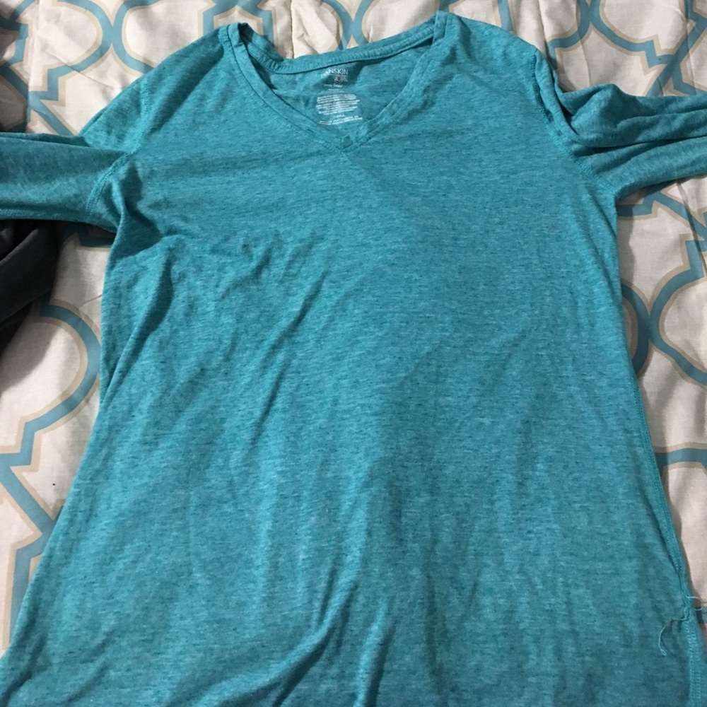 Light blue long sleeved shirt.