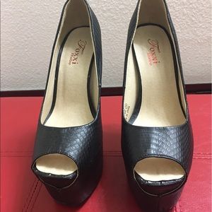 Brown and black snake skin heels