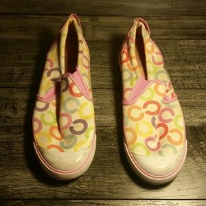 Coach pink, white, and multicolored slip ons.