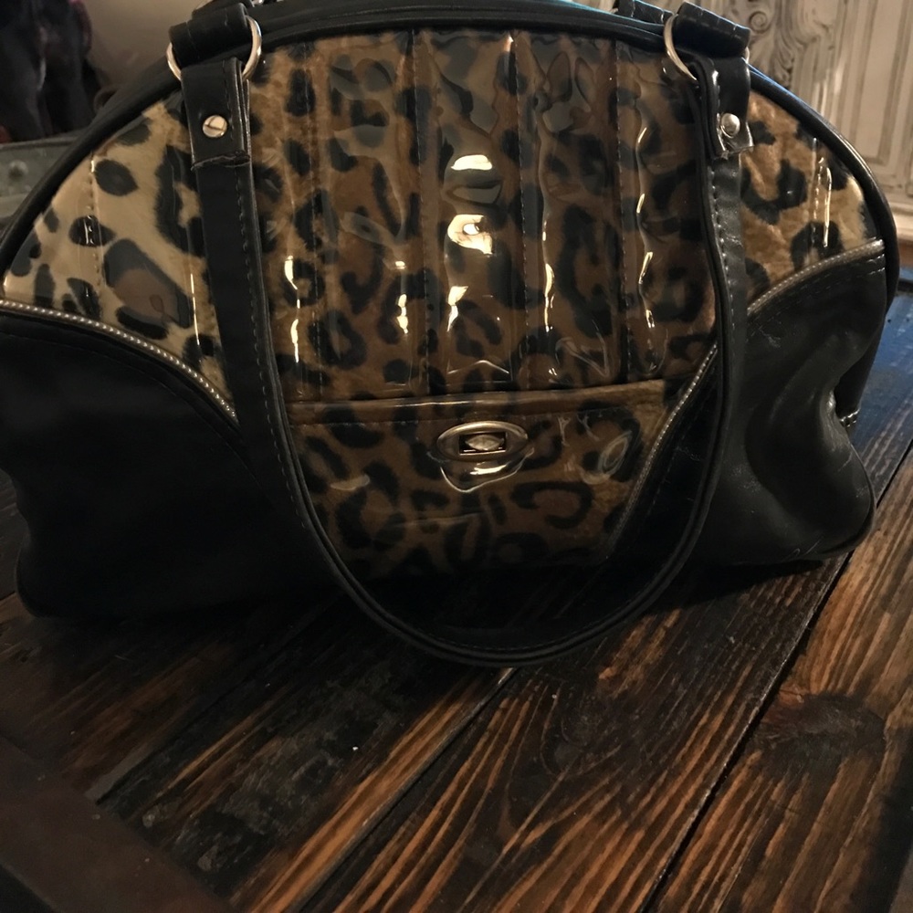 Gently used trophy queen leather handbag