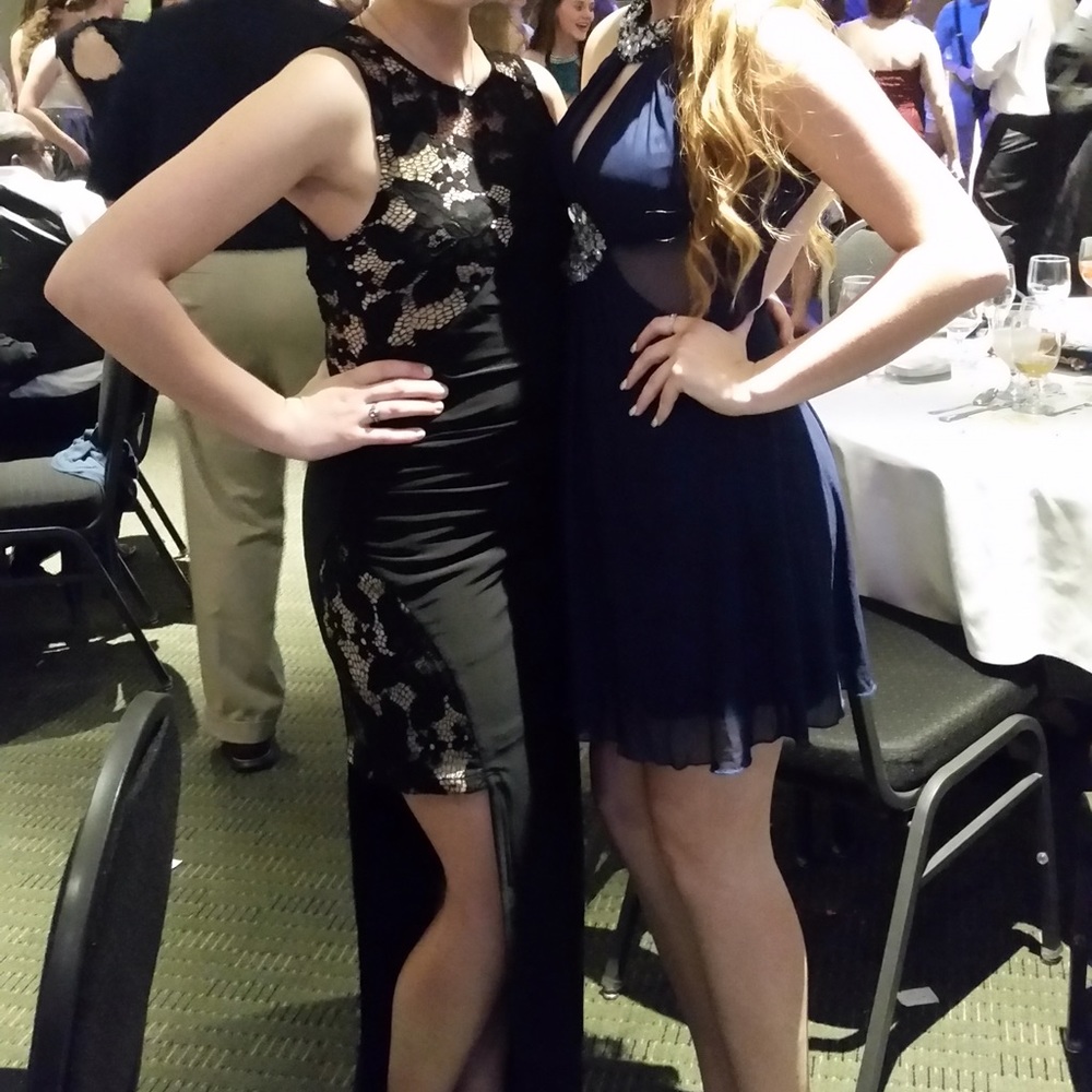 A floor length dress, all black