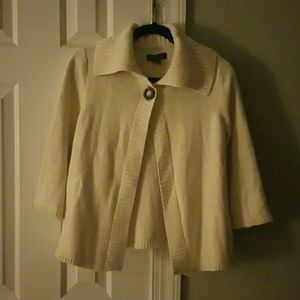 Cardigan, cream colored.