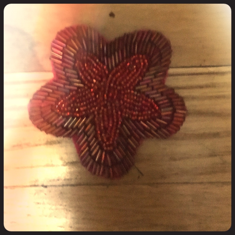 Red beaded flower accessory