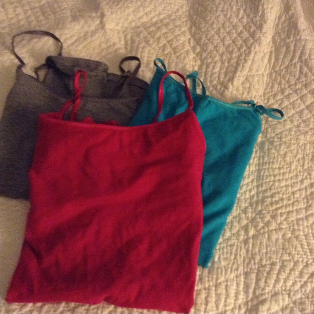 A group of TWO (2) spaghetti strap tees