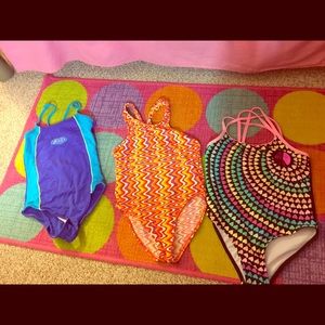 3 girls swim suits with a cover up. Sizes 10/12