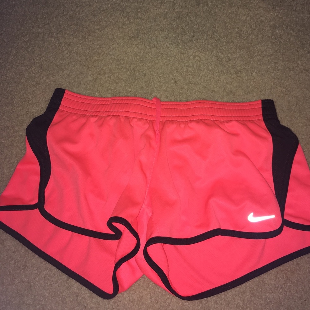 Neon orange Nike shorts