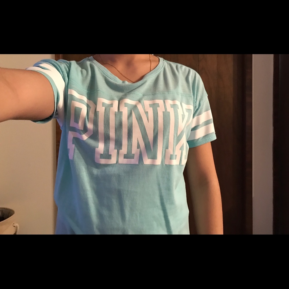 PINK short sleeved shirt.