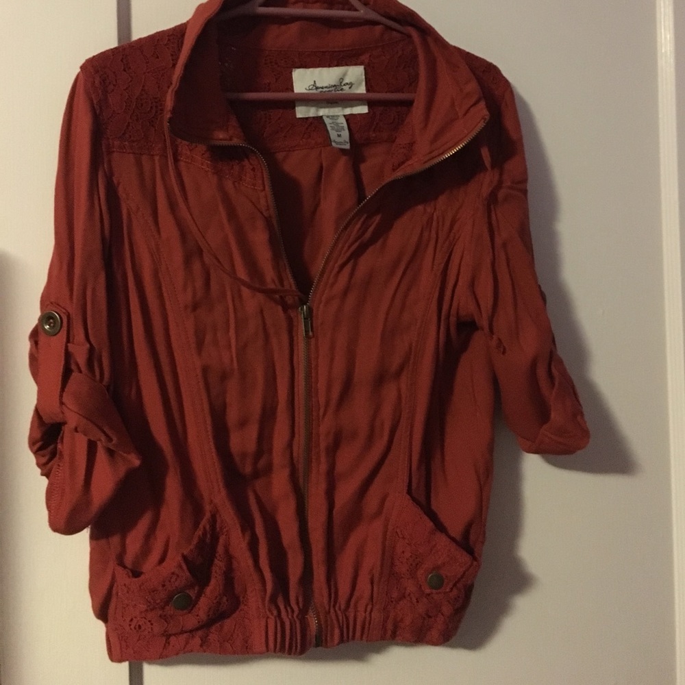 American rag jacket on burnt orange.
