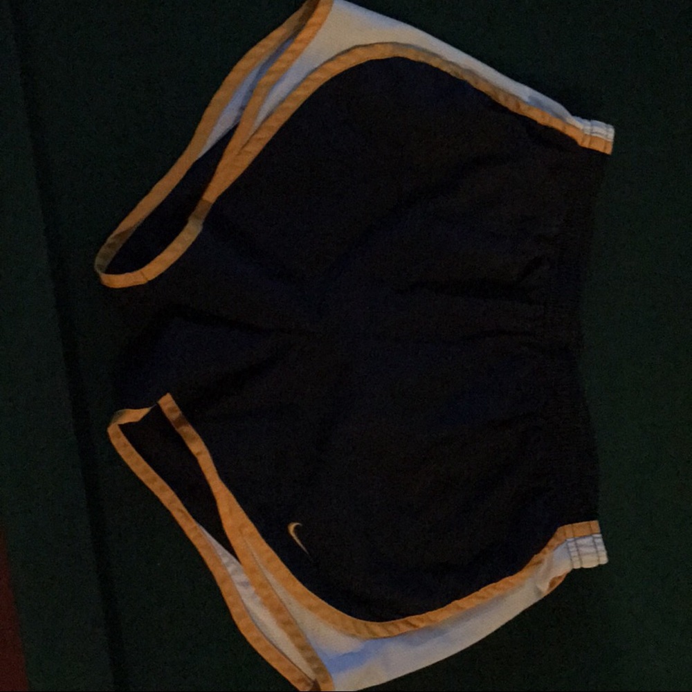 Nike running shorts. Blue with yellow stripes.