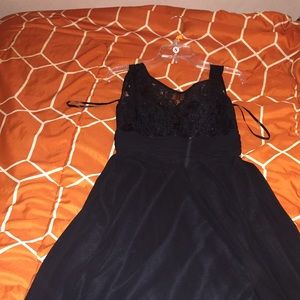 Long , black dress, lace up top.