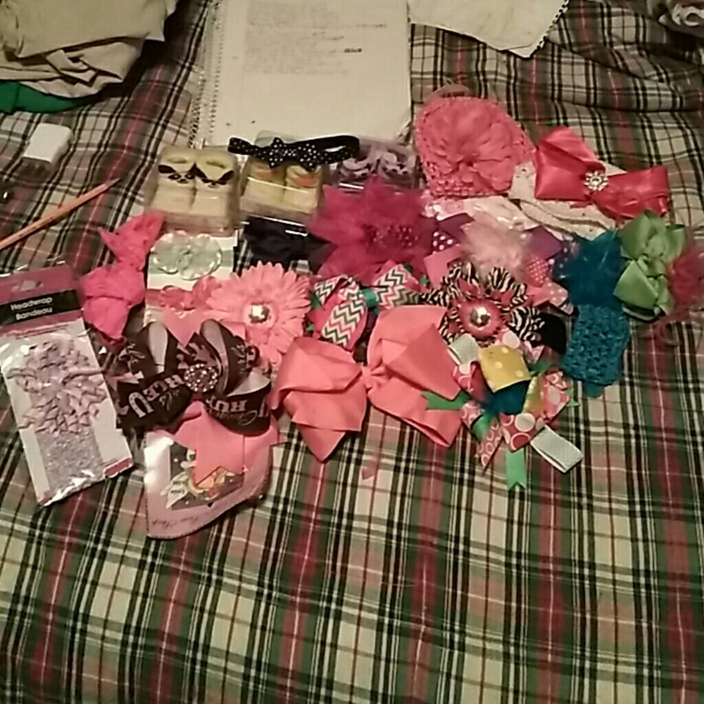 Assortment of hairbows,3 pair of booties,and 2 hat