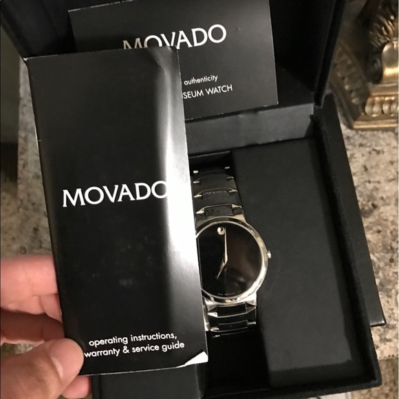 Movado watch with box and papers