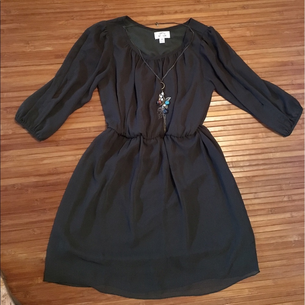 Green dress with sleeve slits