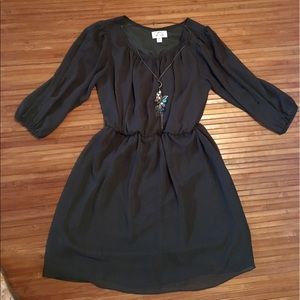 Green dress with sleeve slits