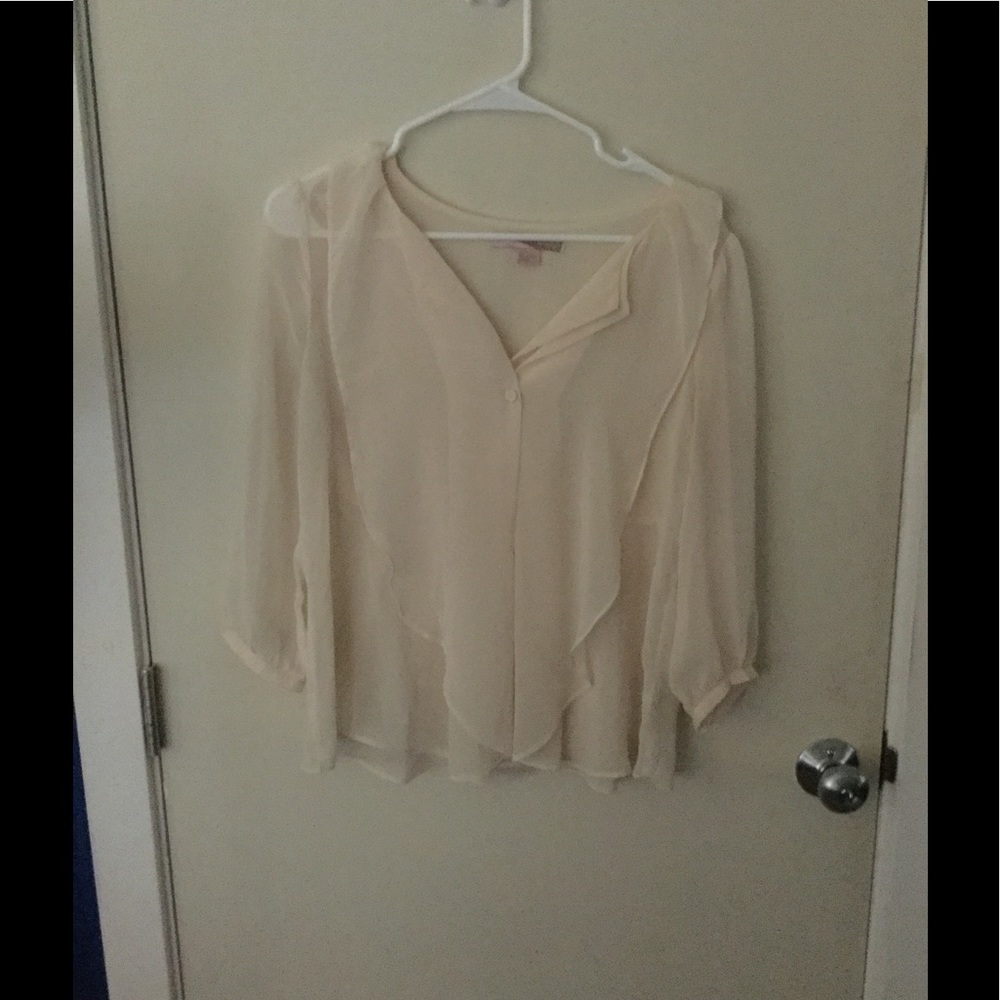 Sheer, cream blouse
