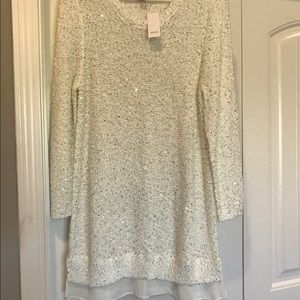 Sweater dress with sheer detail.