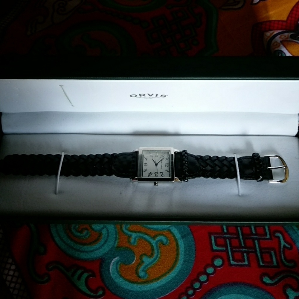 Ladies watch with black faux leather band