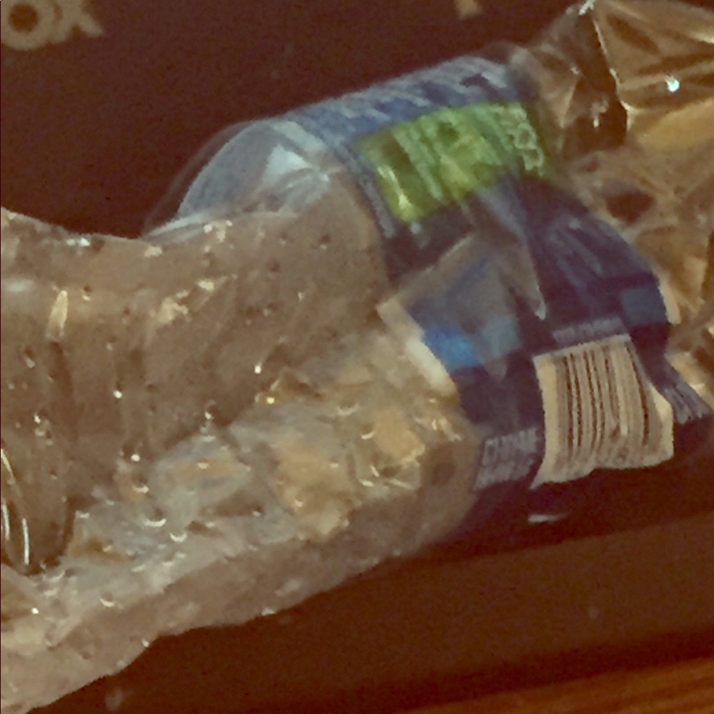 Empty crumbled up water bottle