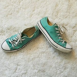 Teal low-top converse