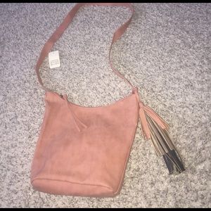 Pink cross body bag.