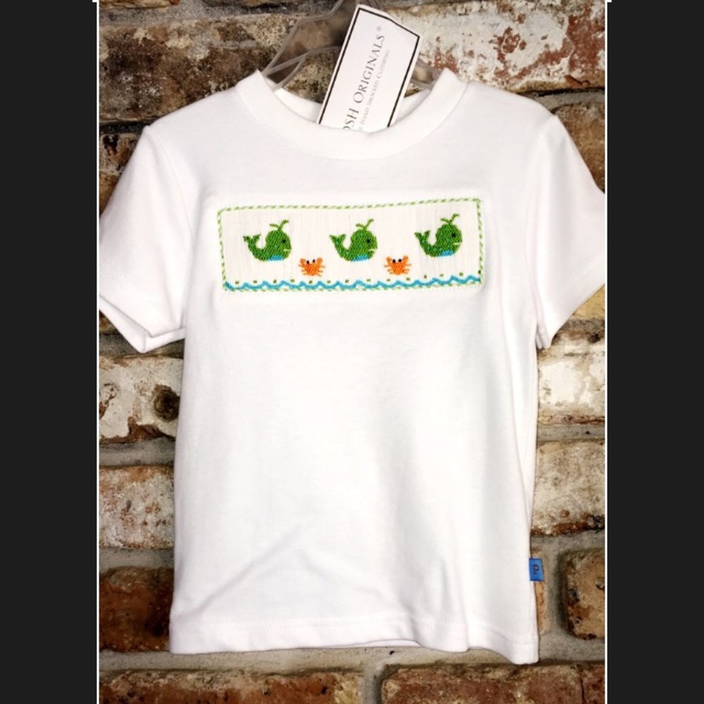 White shirt with smock on the front whales/crabs