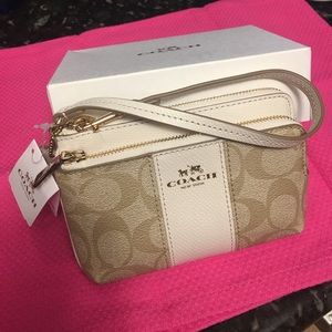 Coach wristlet.  Light khaki/chalk color.