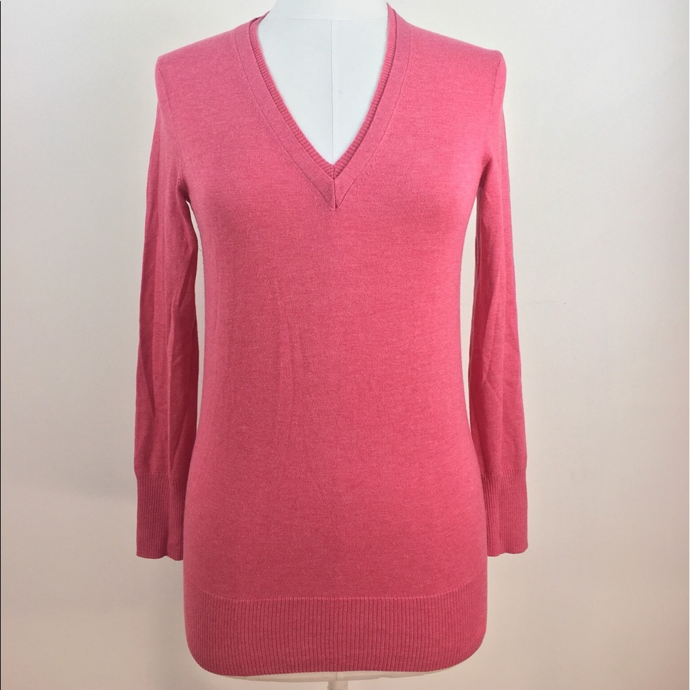 Pink v-neck sweater with faux layered neckline