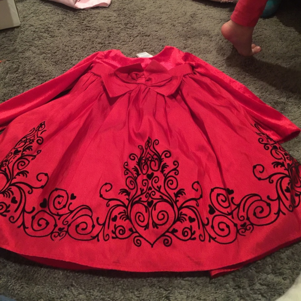 Red dress with beautiful velvet accents.