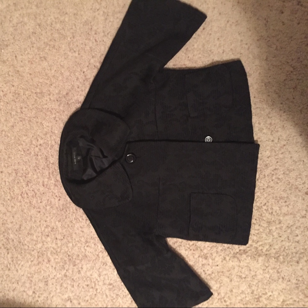 A floral print black jacket.