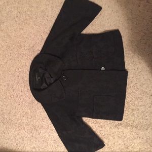 A floral print black jacket.