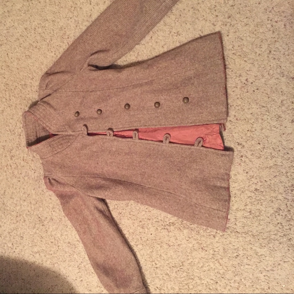 A small beige overcoat.