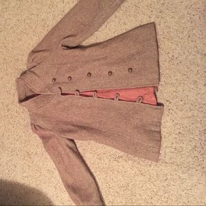 A small beige overcoat.