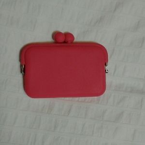 Small, bright pink, silicon pouch.