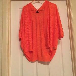 Light orange cardigan.