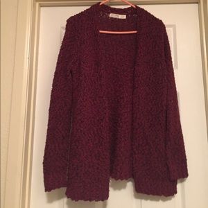 A wine colored cardigan.